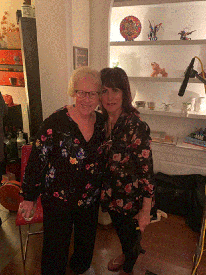 A person standing in a room Description automatically generated