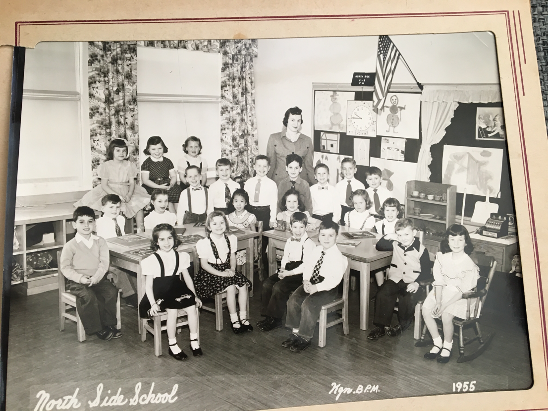 A group of people posing for a photo
Description automatically generated