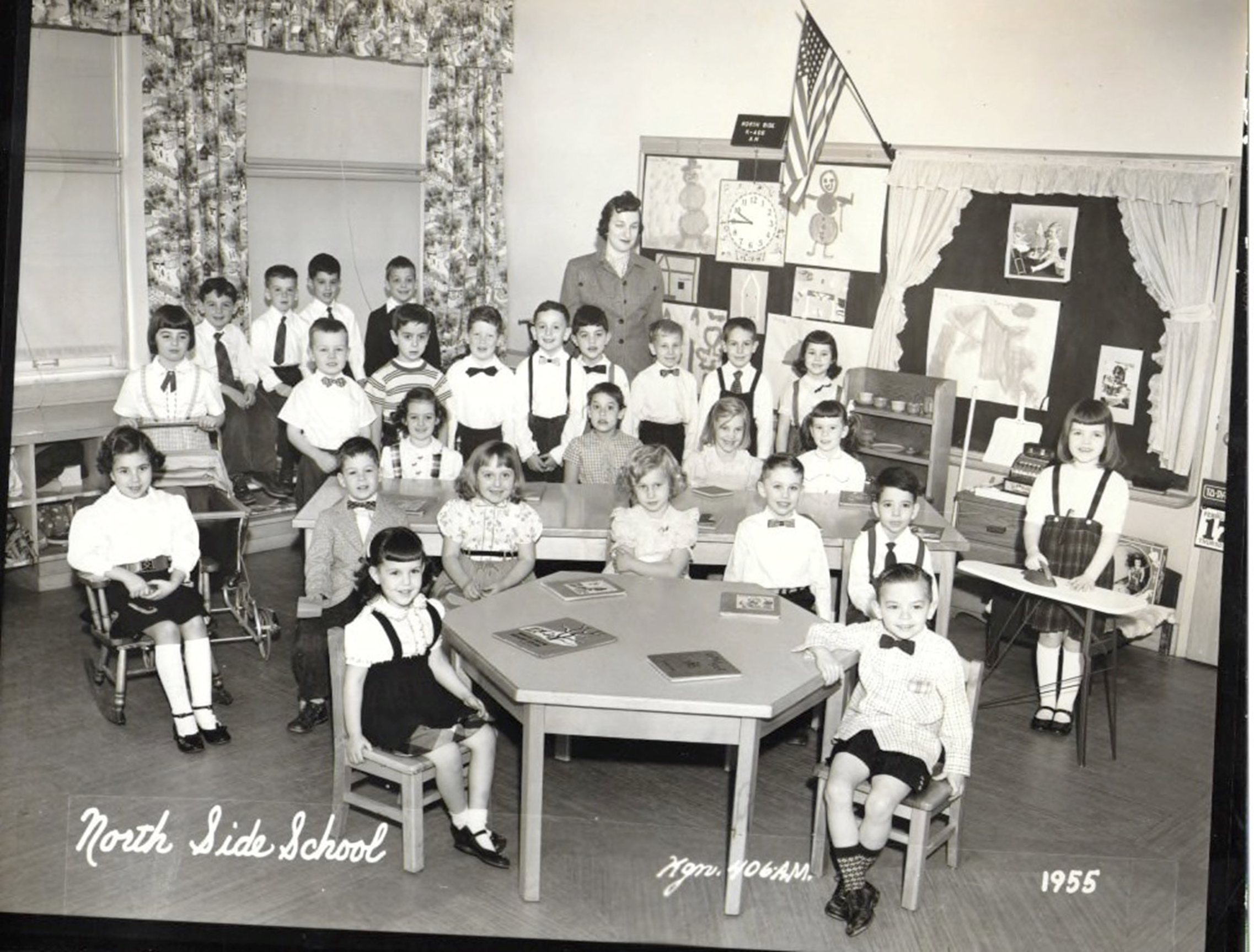 A group of people in a room
Description automatically generated