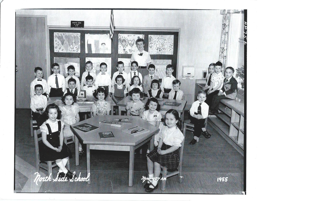 A group of people posing for a photo
Description automatically generated