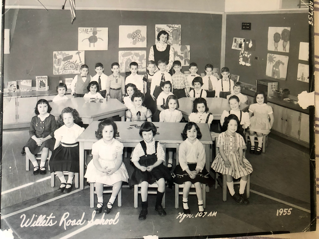 A group of people posing for a photo
Description automatically generated