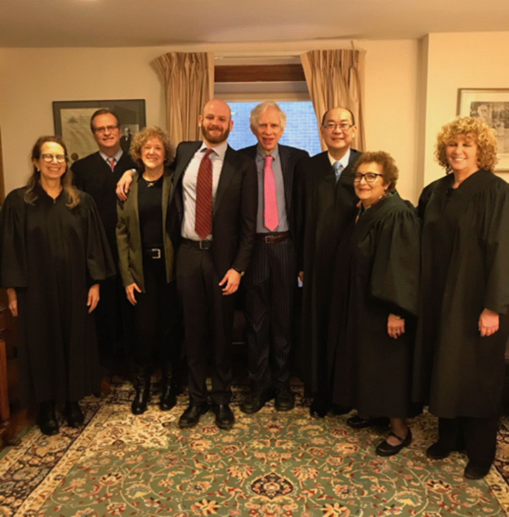 A group of people posing for a photo

Description automatically generated