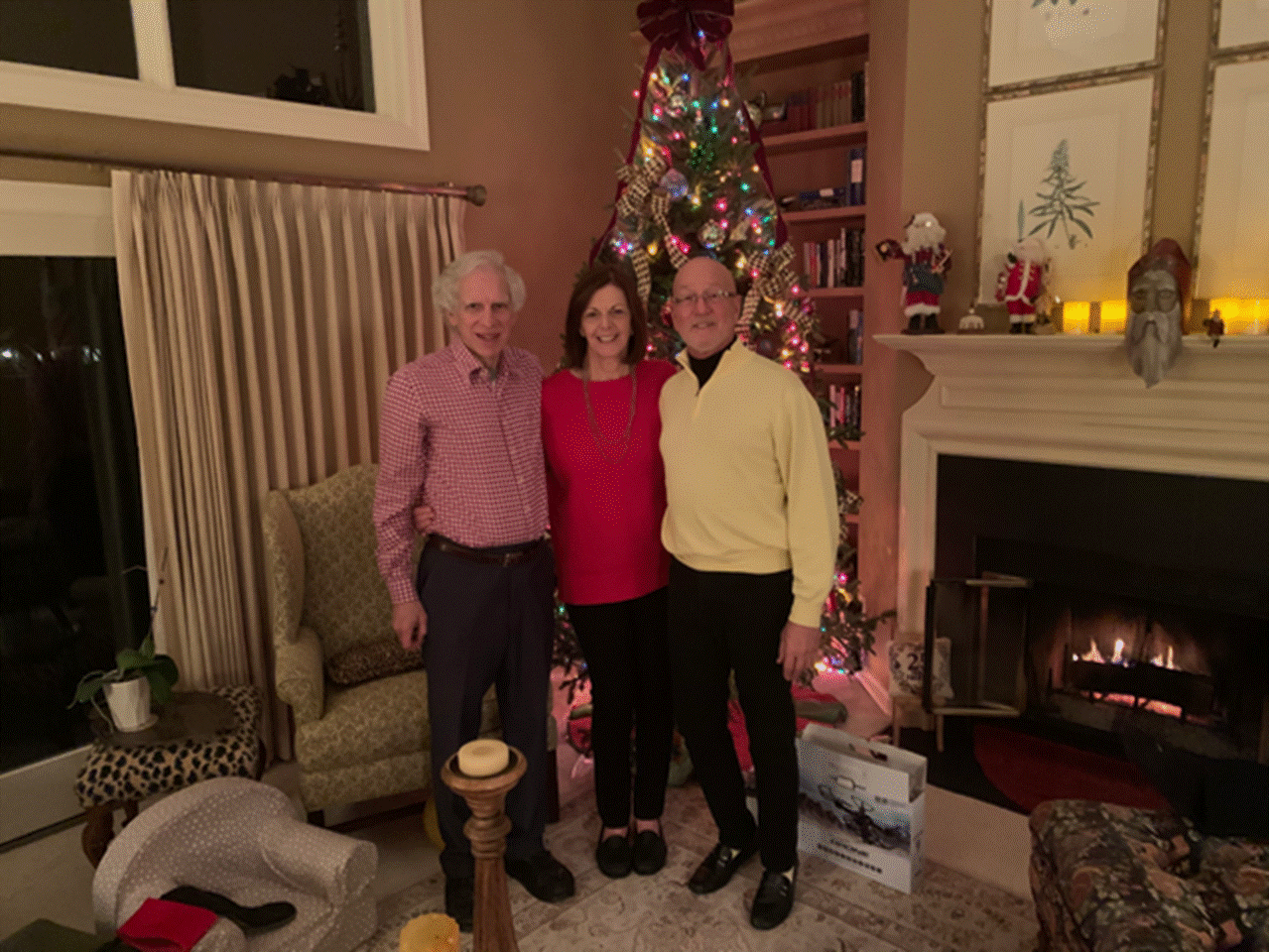 A person standing in a living room playing a video game

Description automatically generated