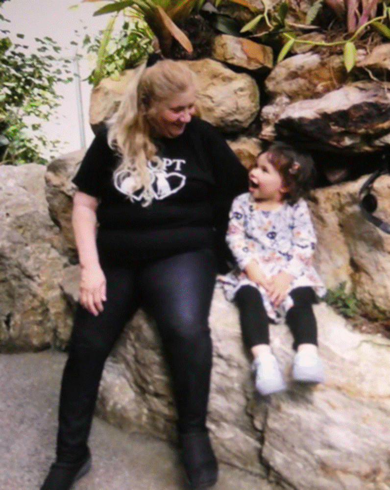 A person standing on a rock

Description automatically generated