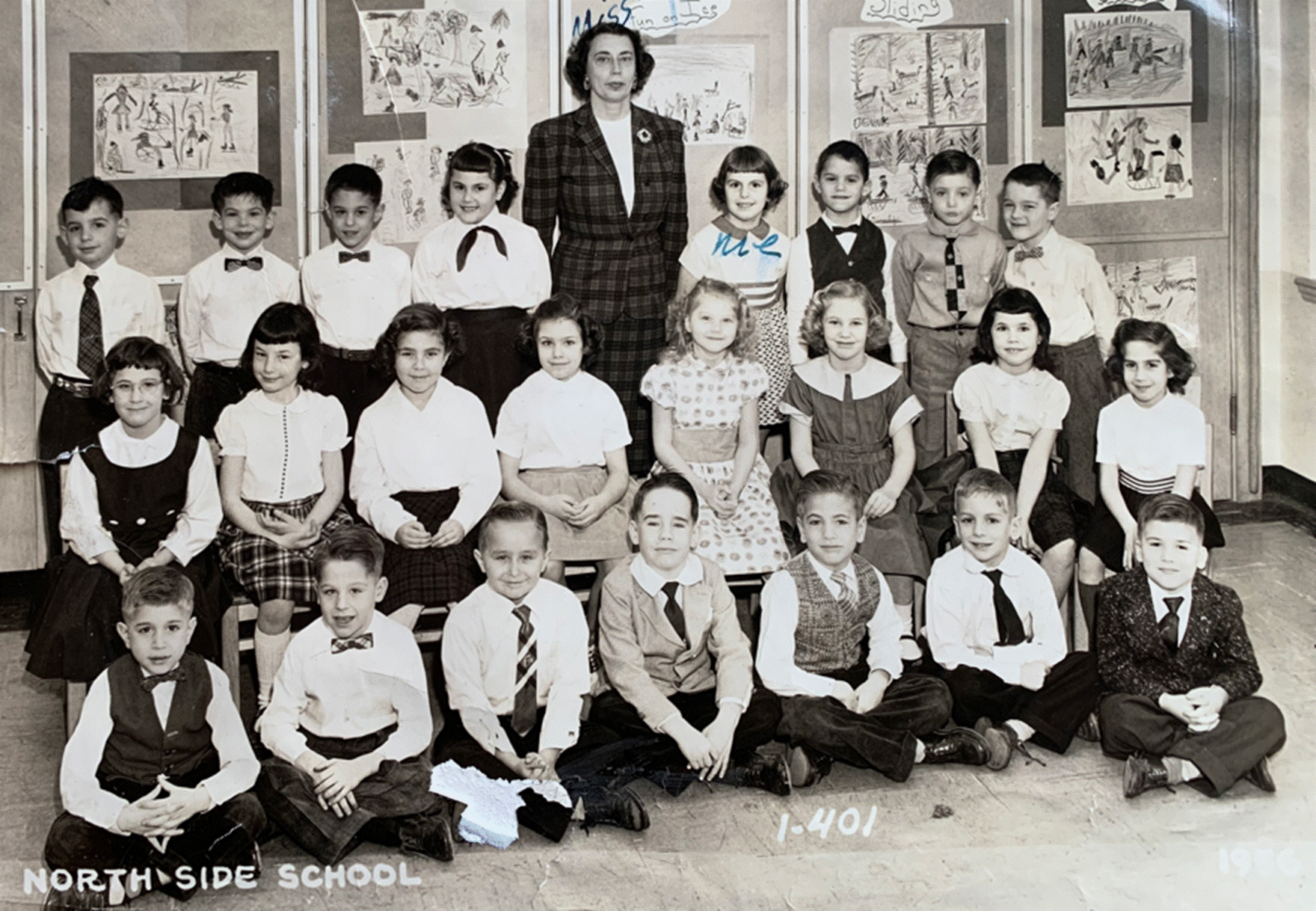 A group of people posing for a photo
Description automatically generated