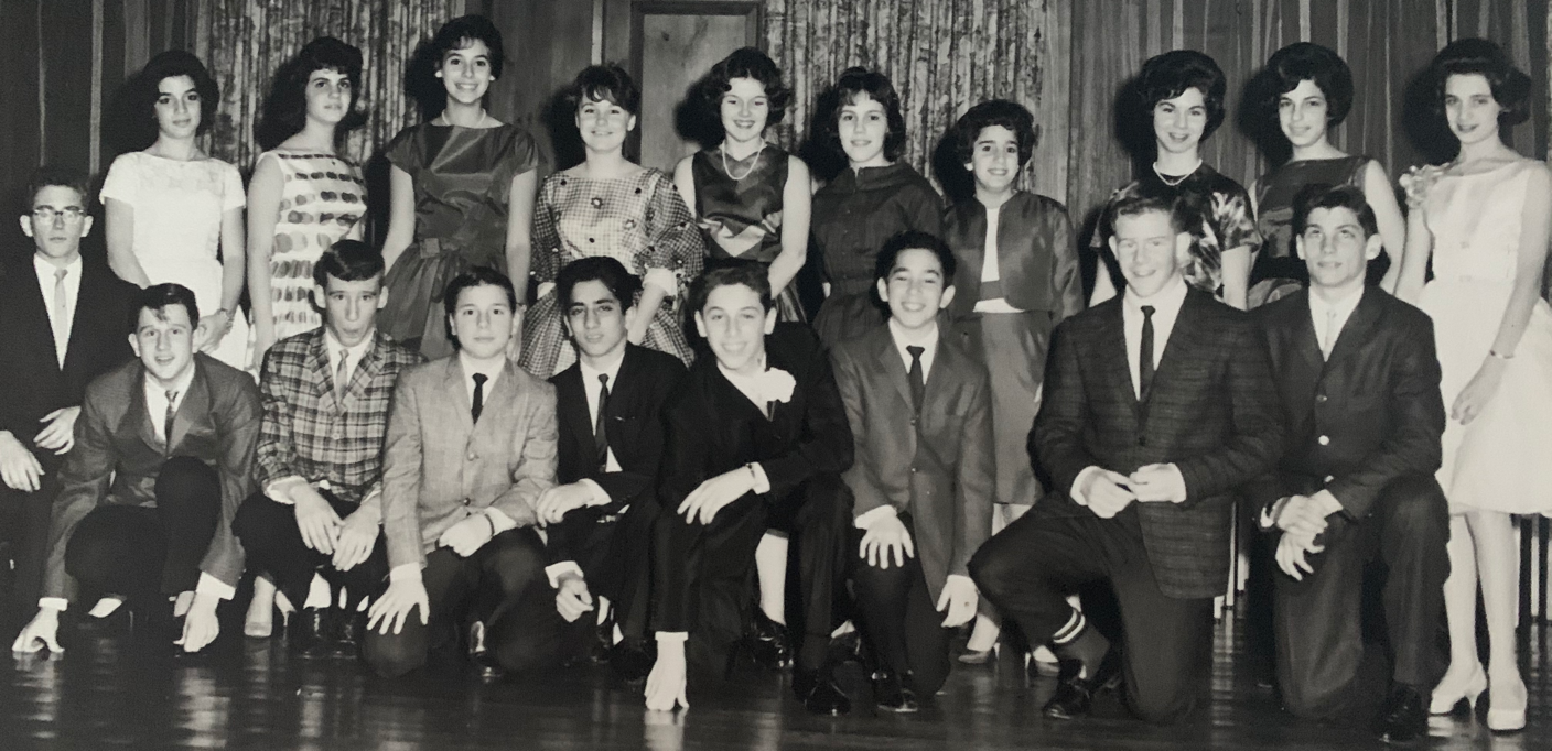 A group of people posing for a photoDescription automatically generated