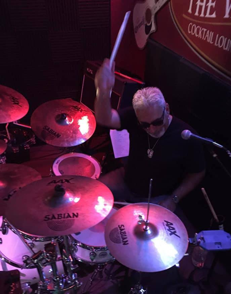 A person standing on a stageDescription automatically generated