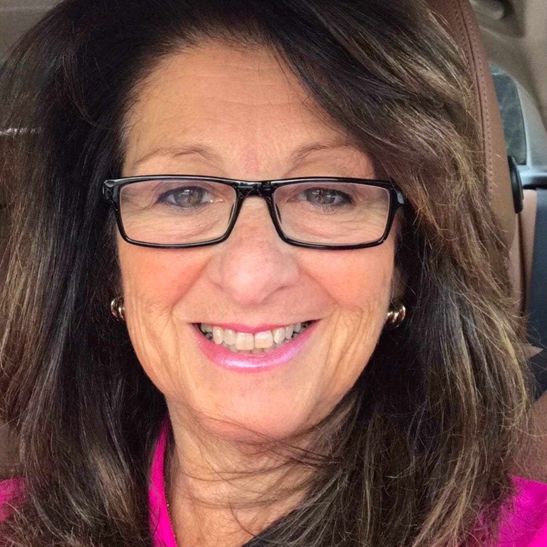 May be an image of 1 person, blonde hair, smiling and eyeglasses