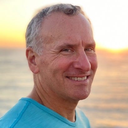 May be an image of 1 person, smiling and ocean